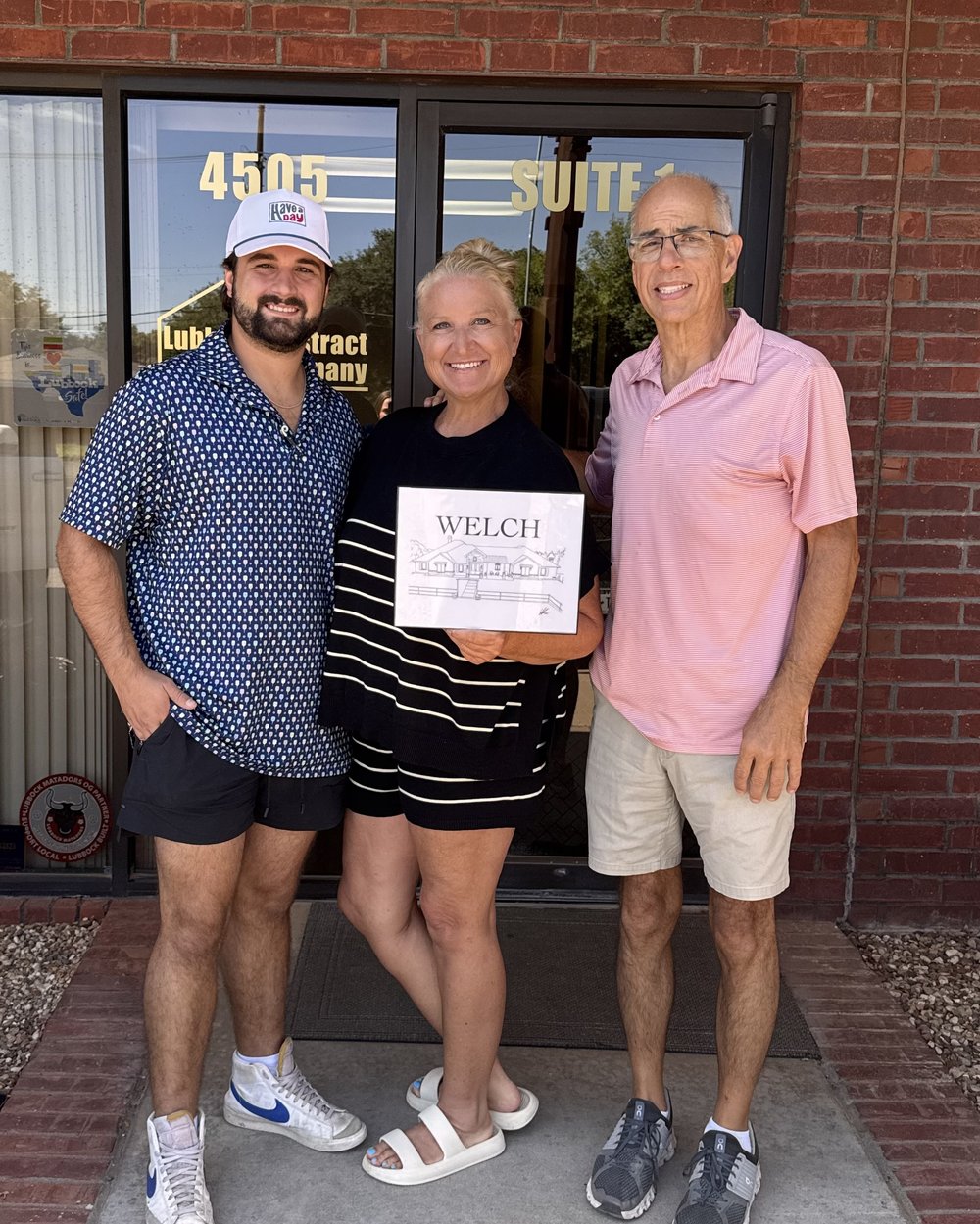 John Thomasson II with clients at their Lubbock home closing